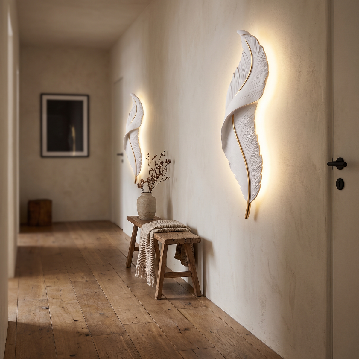 Two Plumea sconces lighting a quiet corridor at night