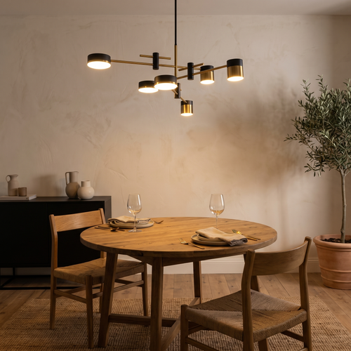 Astraeo chandelier above an oak dining table at night
