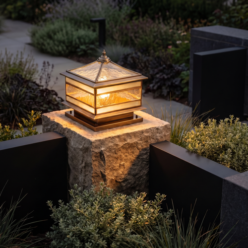 Hardwired Brassano lantern with its glass roof on a stone gate pillar at dusk