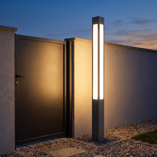 Verdano bollard light at 79 inches beside a garden gate
